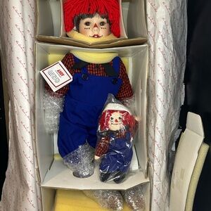 Vintage mint condition porcelain Raggedy Andy Doll with plush raggedy, Andy